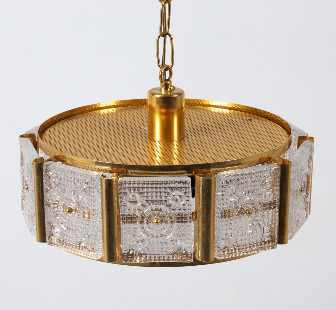 CARL FAGERLUND BRASS & GLASS CHANDELIER C. 1960S: For Orrefors. Gilded brass with textured crystal glass panels. Sweden, circa 1960s. Dimensions: H 6" x Dia. 14". Condition: Wiring untested. Few scuffs and scratches to metal. Wear consistent with age