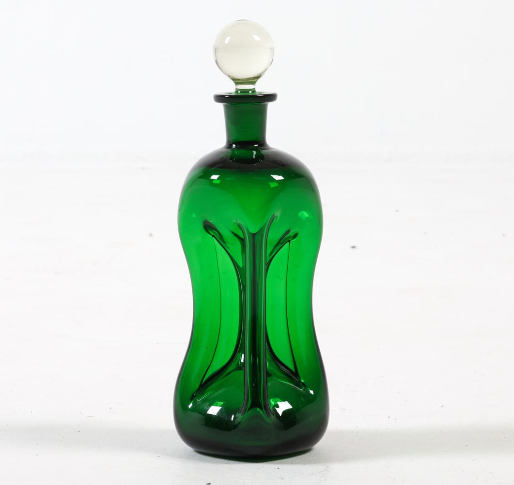 HOLMEGAARD KLUK KLUK GLASS DECANTER C. 1970S: Designed by Jacob Eiler Bang. Hand blown glass. Dimensions: H 12" x Dia. 4". Condition: Few faint scuffs. Wear consistent with age and use.