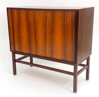 PHILIPS DANISH ROSEWOOD CABINET, CIRCA 1970'S: With Philips name on proper lower left side. With a tambour front sliding door. Dimensions: H 31.5" x W 32.75" x D 14.5" Condition: Very minor finish wear consistent with age and use. E074