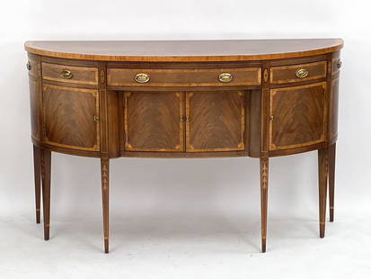 ANTIQUE HICKORY MAHOGANY DEMILUNE SIDEBOARD: American Masterpiece Collection hickory white sideboard. Features tapered legs, banded top with a faded finish, brass pulls, and 3 drawers and 4 doors with interior space. Label inside one drawer.