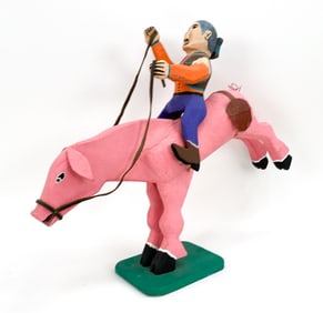 DELBERT BUCK RIDING PIG FOLK ART SCULPTURE