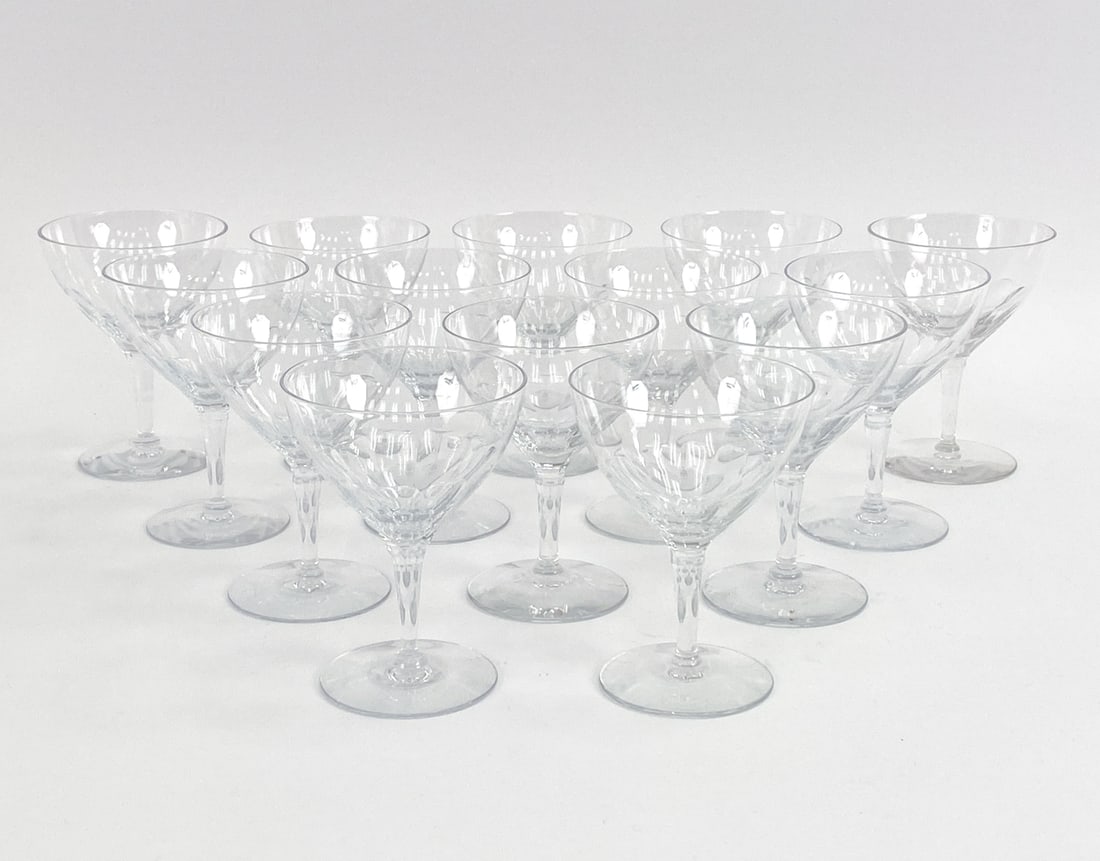 GROUPING OF FOSTORIA GLASSWARE: "Empire" pattern clear-cut glass wine glasses by Fostoria. Marked on undersides. Dimensions: H 5.5" x Dia 4" Condition: Flea bite to bottom edge of one glass. Very light handling wear.