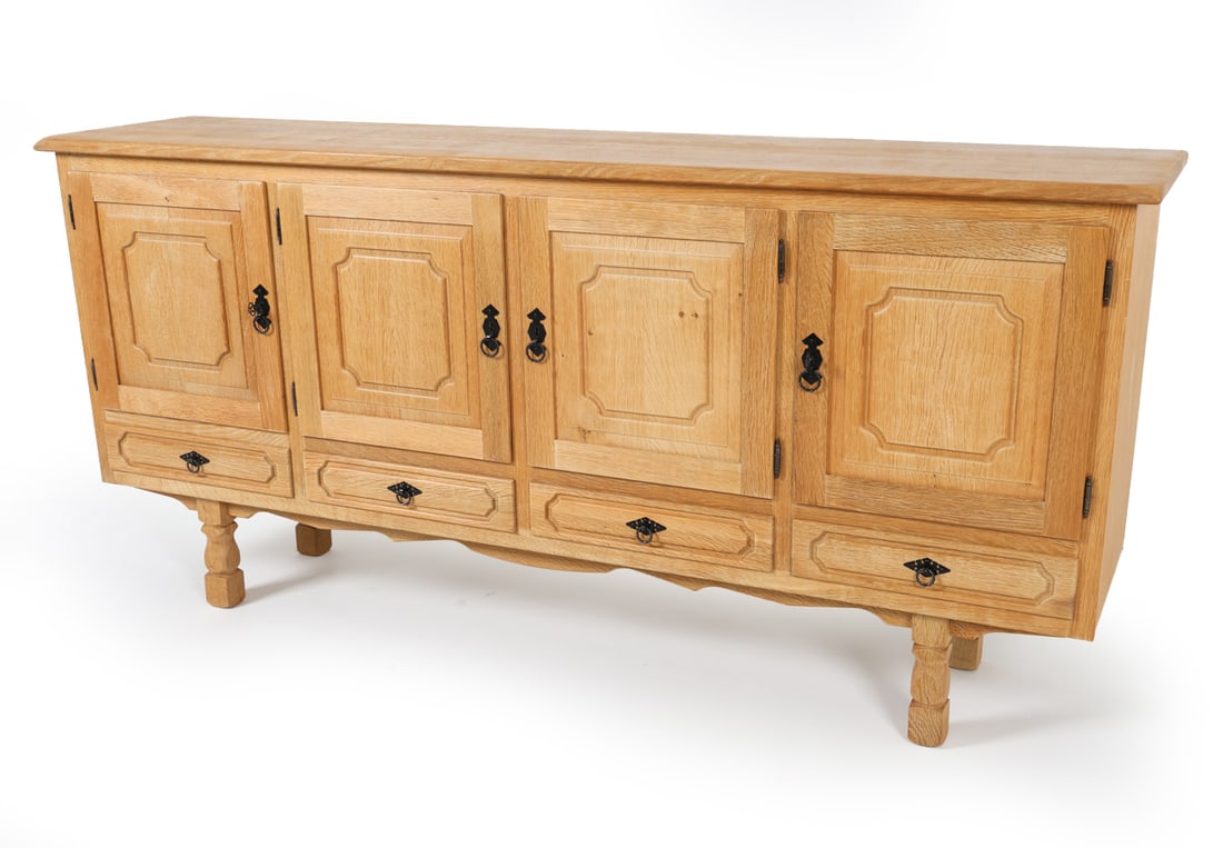 KJAERNULF STYLE DANISH OAK SIDEBOARD C. 1970S: Includes (2) Key. Iron hardware. Dimensions: H 37" x W 79.25" x D 17.75" Condition: Scattered dings and marks. proper left cabinet has musty odor. Presents well overall.