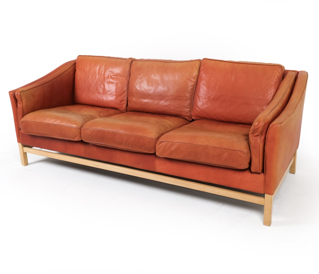 STOUBY DANISH BEECH & LEATHER SOFA C. 1970S: Marked Stouby to fabric lining. Dimensions: H 29" x W 80" x D 31", SH 17" Condition: Moderate sun fading to upholstery. Moderate discoloration and slight blemishes to cushions. Scattered scratches and