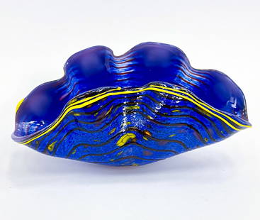 DALE CHIHULY CLAM FORM HAND-BLOWN GLASS VASE: Clam shell form art glass, hand-blown. This glass showcases yellows and blues. Signed and dated 93' on underside. Dimensions: H 4.5" x W 8.5" x D 3.5" Condition: In great shape, no issues to note.