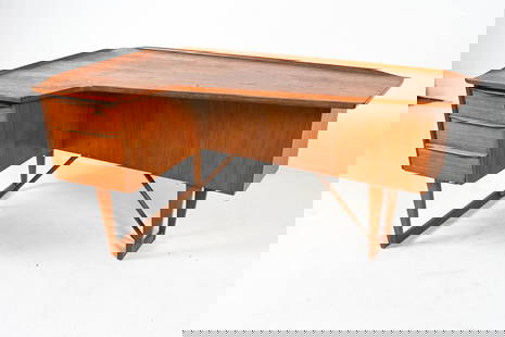 PETER LOVIG NIELSEN DANISH TEAK 'BOOMERANG' DESK: A stunning example of Atomic Age design, this teak executive desk by Peter Lovig Nielsen for Hedensted Mobelfabrik features a bold boomerang silhouette and a mirrored dry bar. Dimensions: Height: 29 i