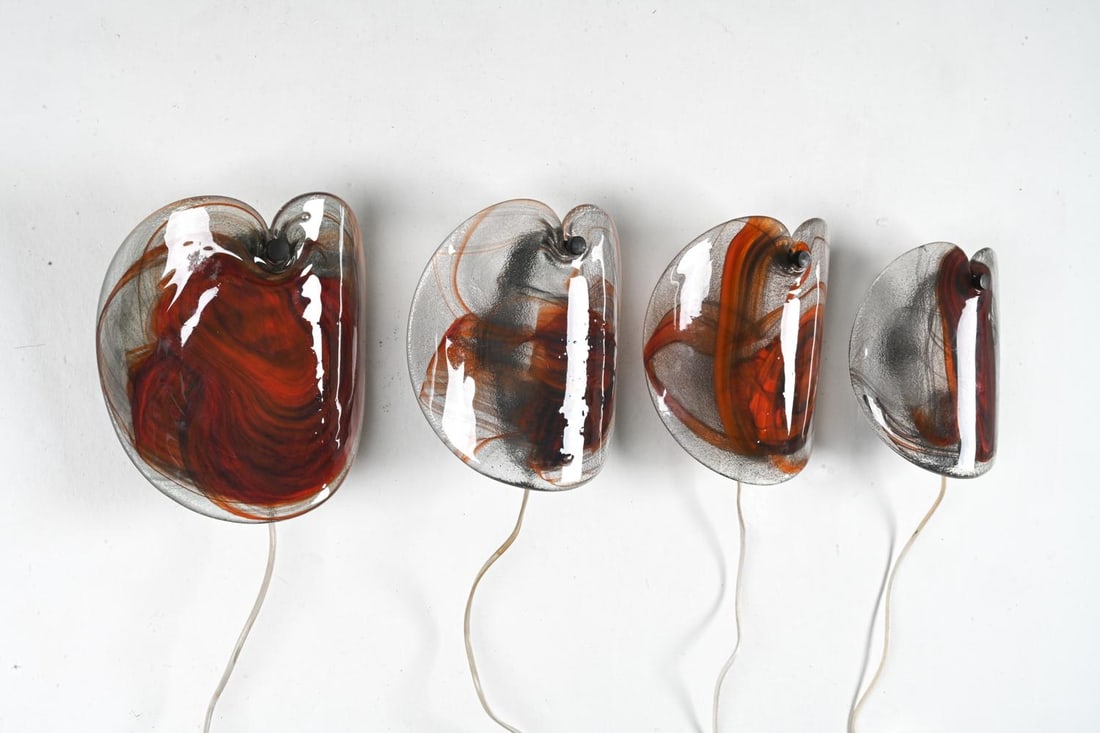 PER LUTKEN FOR HOLMEGAARD ART GLASS SCONCES: 4 in total. Labeled. Designed by Per Lutken for Holmegaard. Danish, Circa 1970s. Elevate your space with these exquisite art glass sconces, designed by the renowned glass artist Per L?tken and produce