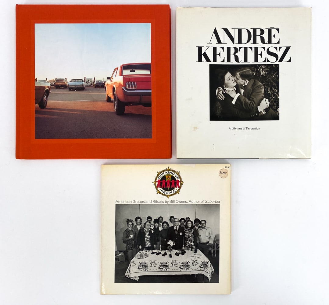 GROUPING OF PHOTOGRAPHY BOOKS: Includes Andre Kertesz: A Life of Perception, William Eggleston: 2 1/4 3rd printing, and Bill Owens: Our Kind of People (1st edition in paperback, signed). Dimensions: (Largest) H 11.75" x W 12" Condi