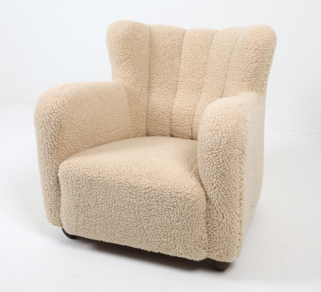 FLEMMING LASSEN STYLE DANISH LAMBS WOOL EASY CHAIR: Easy chair upholstered in white lambs wool with oak legs. Denmark, circa 1940s. Dimensions: H 32.75" x W 33" x D 28", SH 16" Condition: Minor frays to wool JE B096