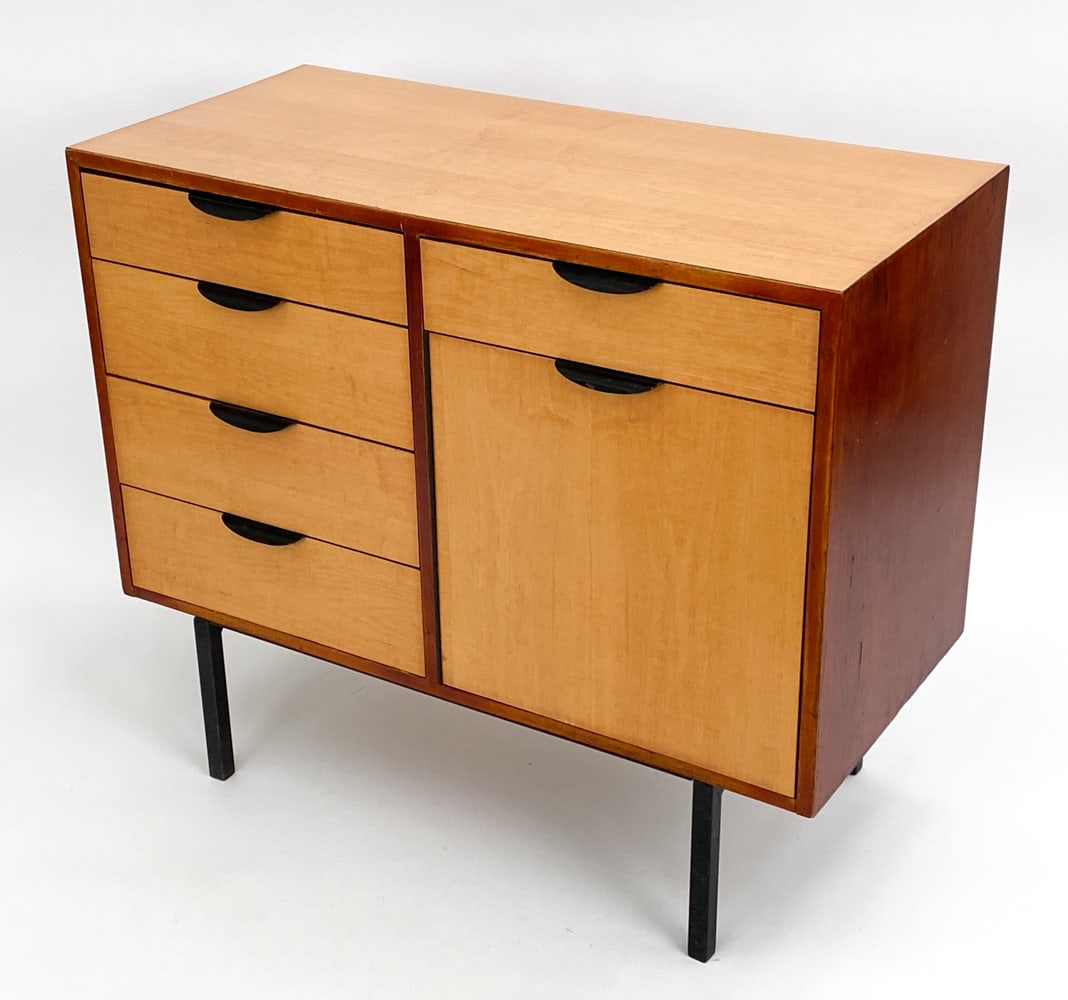 GERALD LUSS CABINET FOR CARROM INDUSTRIES: Teak with contrasting birch wood doors. Dimensions: H 33.5" x W 39" x D 18" Condition: Scattered blemishes to exterior and interior drawers. Faint odor to drawers. Rubbing and marks to edges. Wear con