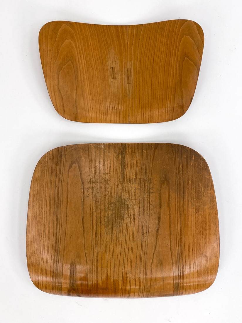 VINTAGE CHARLES & RAY EAMES DCM OAK SEAT & BACK: No apparent labels. Largest seat has numbers stamped to underside. Dimensions: (largest) W 19.5" x W 17.75" Condition: Moderate scratches and scuffs to wood.