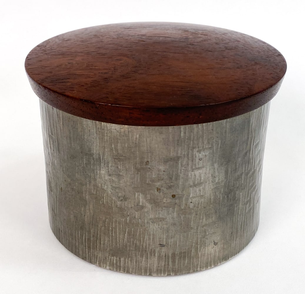 PEWTER & COCOBOLO DRESSER JAR: Indistinctly signed on underside. Marked Pewter and Cocobolo. Dimensions: H 3.5" x Dia 4.75" Condition: Scratches to underside and residue to interior.