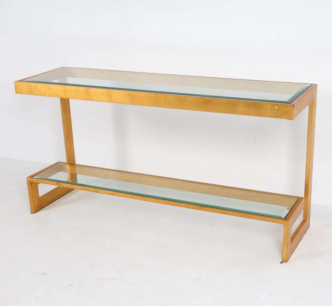 BELGOCHROM HOLLYWOOD REGENCY CONSOLE C. 1970S: Gilt metal console table with smoked glass panels. Dimensions: H 28" x W 55" x D 16" Condition: Slight scuffs and rubbing to finish over metal. Wear consistent with age and use.