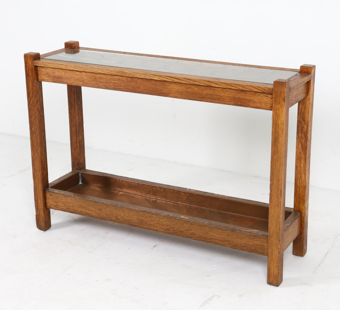 OAK CANE OR UMBRELLA HOLDER CONSOLE TABLE: Copper plate to lower shelf. With glass top. Dimensions: H 29" x W 42.5": x D 12" Condition: Moderate rubbing to edges. Marks, scuff and dings. Wear consistent with age and use.
