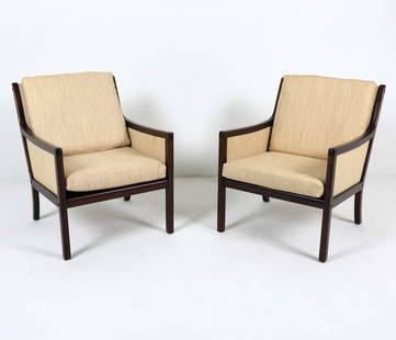 PAIR OLE WANSCHER MAHOGANY & WOOL LOUNGE CHAIRS: P. Jeppesens. Tagged underneath to frame. Mahogany frames with off-white wool upholstery. Denmark, circa 1960s. Dimensions: H 34" x W 25.25" x D 26.75" x SH 16.75". Condition: Slight musty odor. Few r