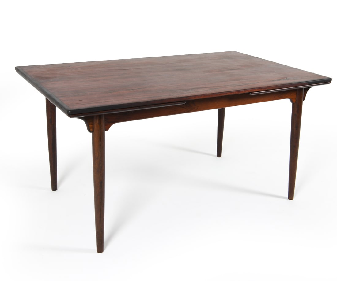 OMANN JUN DANISH ROSEWOOD EXTENDING DINING TABLE: (2) Leaves included, stored within table. Dimensions: H 28.75" x W 58" x D 35.25". Leaf W 21.25". Condition: Minor scuffs and dings to legs. Wear consistent with age and use. JBN 035