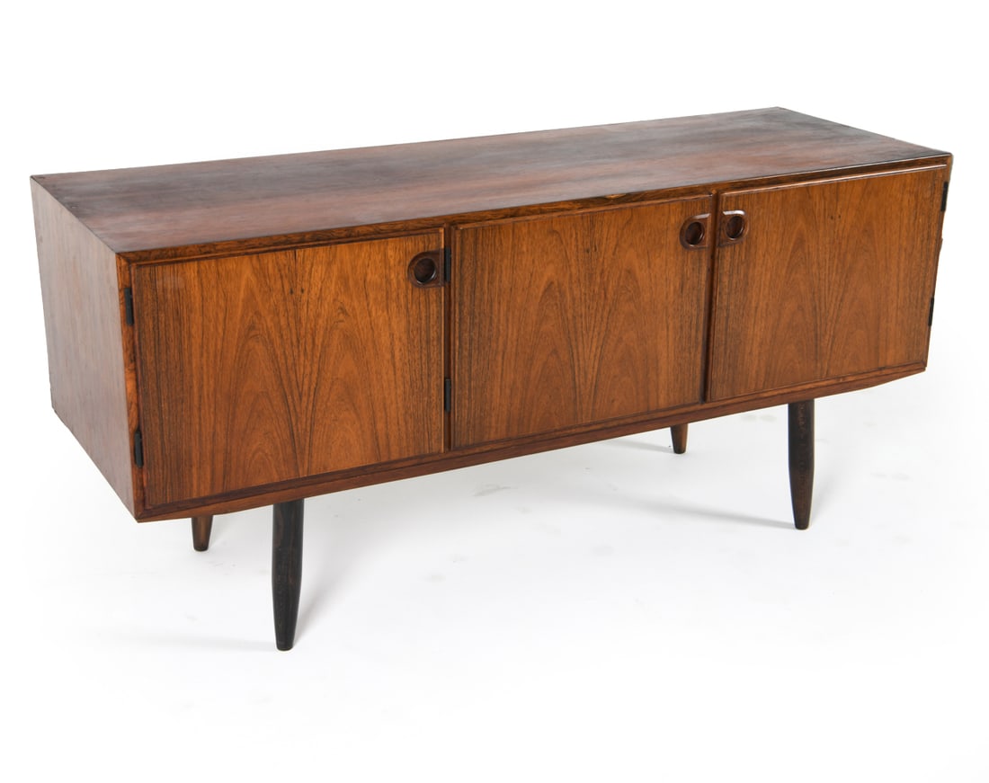 SVEND ELLEKAER DANISH ROSEWOOD SIDEBOARD: Adjustable shelves. Dimensions: H 28" x W 59" x D 20.5". Condition: Minor scuffs. Some sun fading to side. Wear consistent with age and use. JBN 092