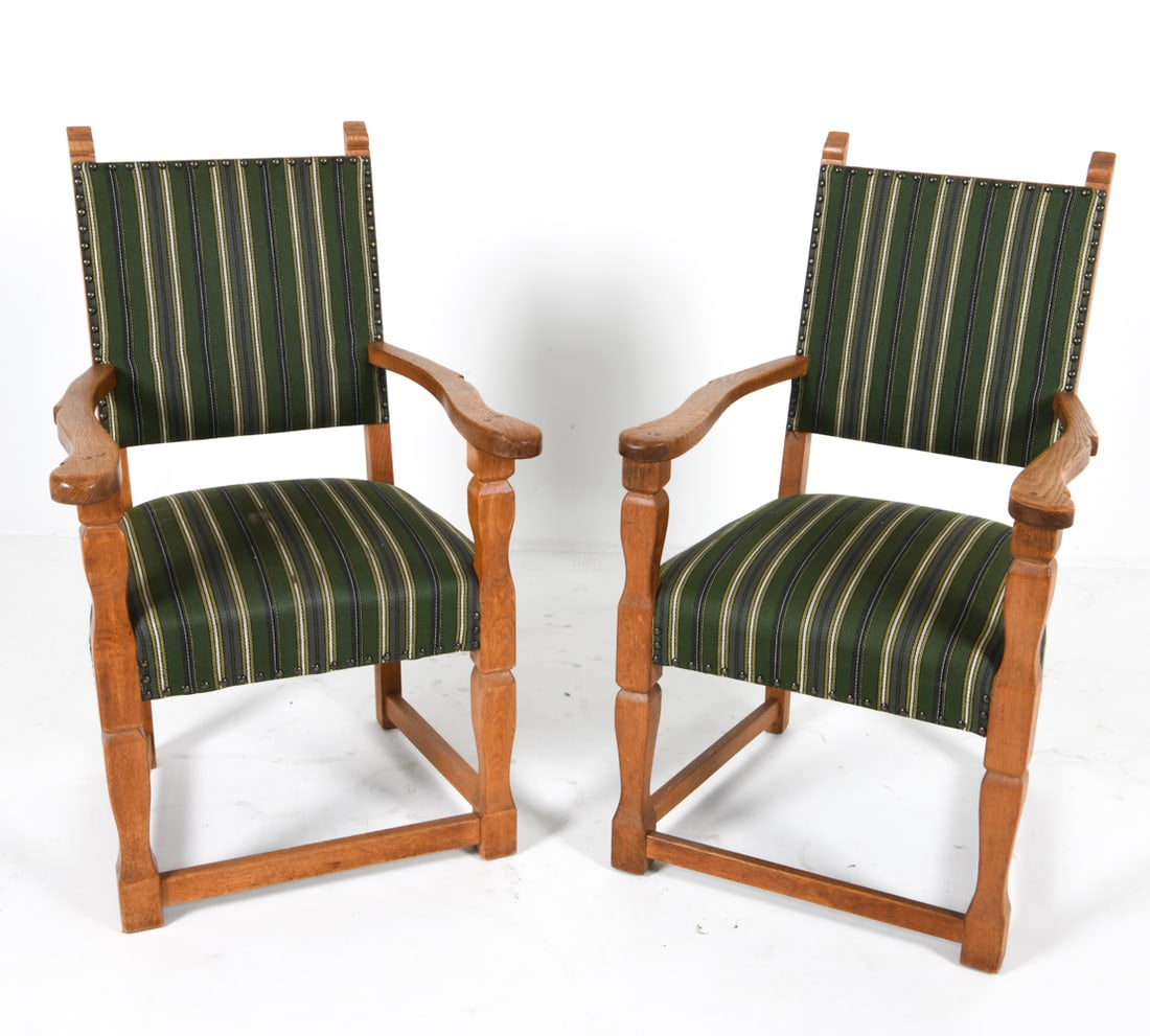 PAIR OF HENNING KJAERNULF OAK ARM CHAIRS C. 1970S: Oak frames with wool upholstery. Brass tacks accents. Denmark, circa 1970s. Dimensions: H 41" x W 25" x D 24" x SH 19". Condition: Few worn spots to wool on seats. Wear consistent with age and use. JB
