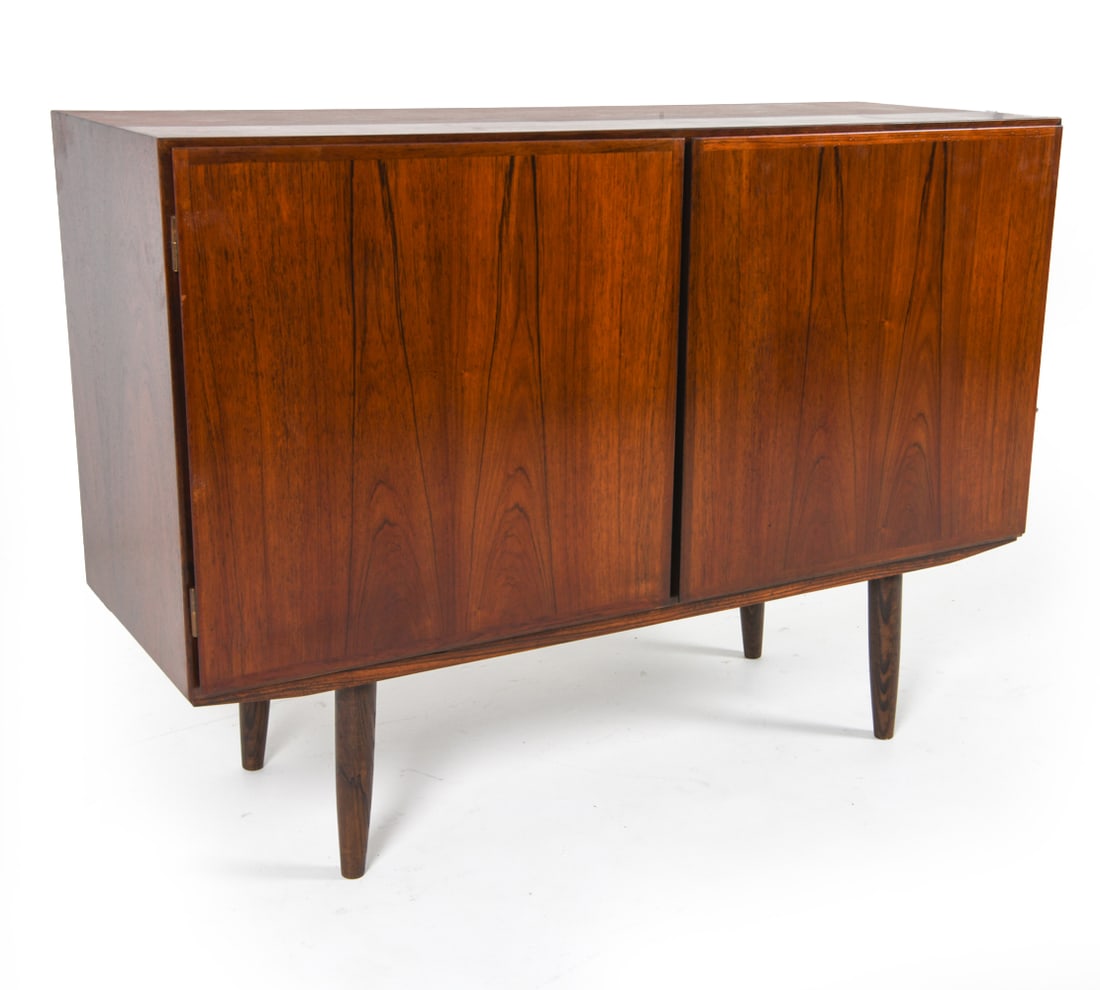 OMANN JUN MODEL 4 DANISH ROSEWOOD SIDEBOARD: Rosewood sideboard cabinet. Adjustable shelves and drawers. Tag inside cabinet. Denmark, circa 1960s. Dimensions: H 34" x W 47.25" x D 17". Condition: Faint surface scratches. Wear consistent with age