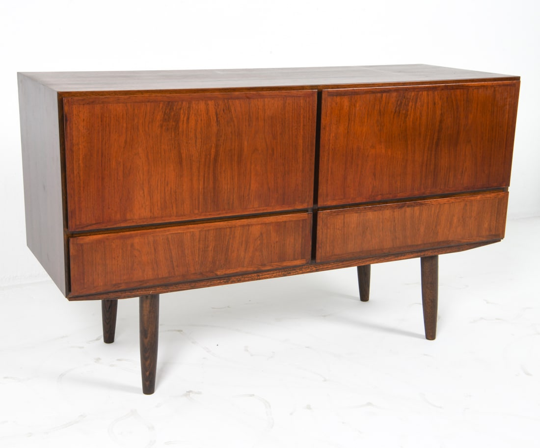 OMANN JUN MODEL 2 DANISH ROSEWOOD CHEST C. 1960S: Rosewood sideboard or chest with (4) drawers. Tag to back top corner. Denmark, circa 1960s. Dimensions: H 28.25" x W 47.5" x D 17.25". Condition: Few faint scratches and impressions to top. Wear consi