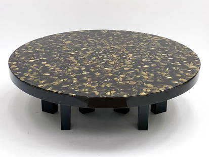 CUSTOM CAST RESIN BRASS SHARD COFFEE TABLE: Coffee table with a solid black iron base and a round cast resin black top with shards of brass imbedded into it. With invoice. Provenance: From a Park Ave Manhattan apartment designed by David Kleinb