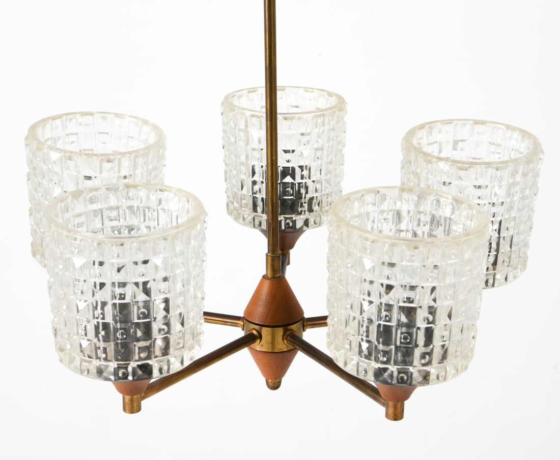 MID-CENTURY DANISH TEAK & BRASS CHANDELIER C. 1970: Teak with brass posts and textured glass shades. Dimensions: H 22.25" x Dia 17" Condition: Tarnishing to brass posts. Minor scratches to center post. Untested. Presents well overall.