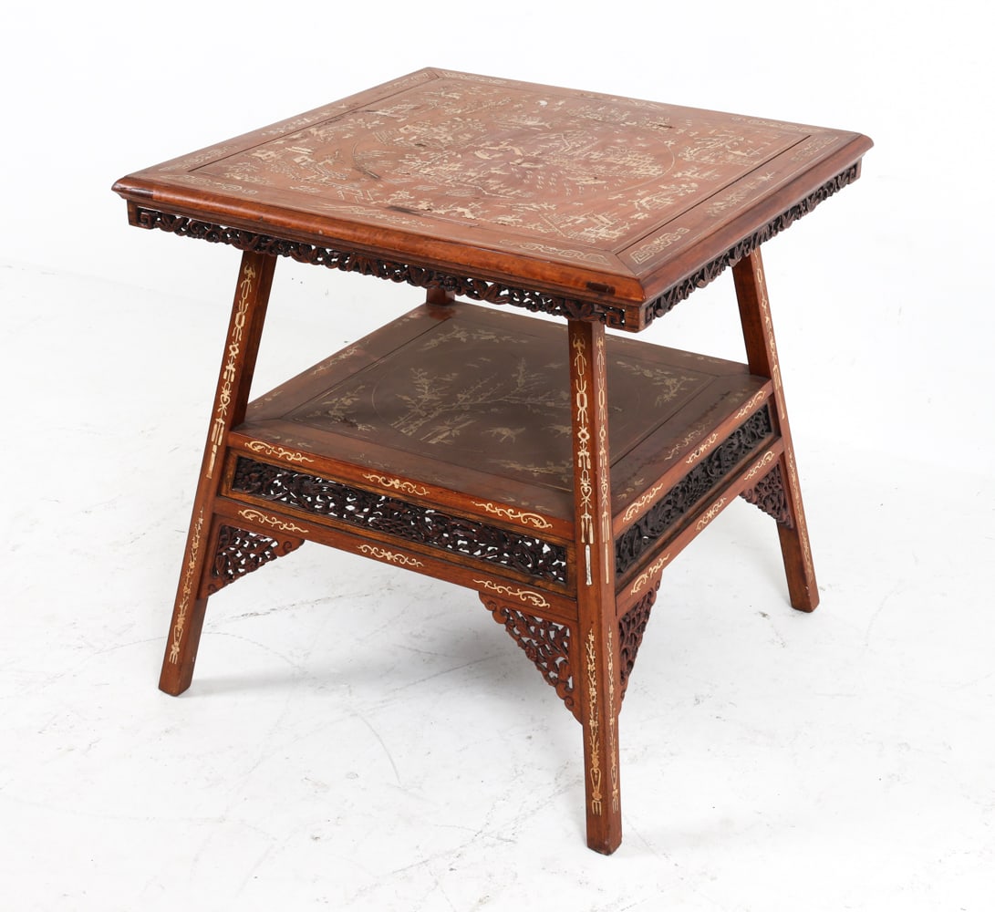 ANTIQUE CHINESE BONE INLAID TABLE: Circa 19th century. Carved detailing to apron and lower edges with inlaid bone throughout. Dimensions: H 25.5" x W 24.75" x D 24.5" Condition: Slight separation to table top. Tape residue to surface.