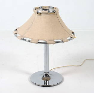 ANNA EHRNER FOR LYKTAN SWEDISH CHROME TABLE LAMP: Circa 1970s. Labeled underneath Chrome center post with pulled canvas shade. Dimensions: H 27" x Dia 21" Condition: Minor blemishes to canvas shade. Slight scuffs to chrome post. Cut wire, Untested. P