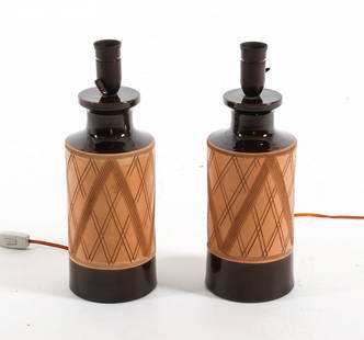 MID-CENTURY ITALIAN CERAMIC TABLE LAMPS C. 1970S: Labels to undersides. Etched designs to ceramic surface. Dimensions: H 15" x Dia 5.5" Condition: Slight marks to surface. With European plug. Untested, Presents well overall.