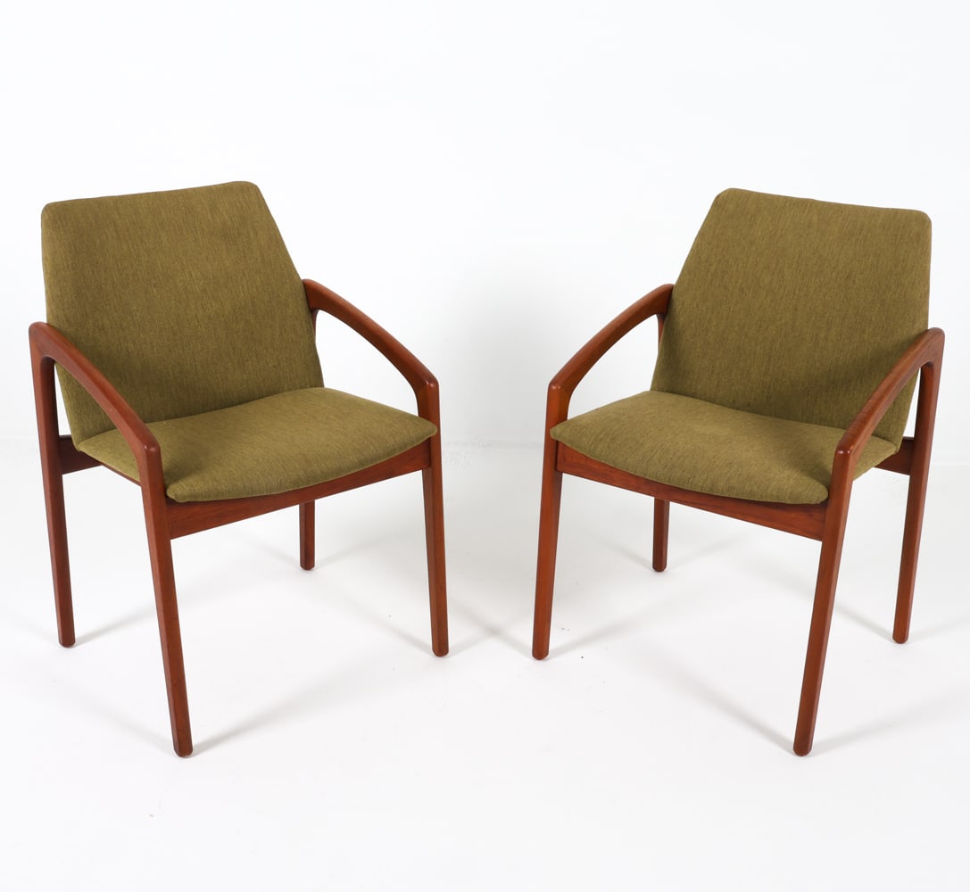 PAIR OF HENNING KJAERNULF MODEL 23 ARMCHAIRS: Apparently unsigned. Teak frames with green-tone wool upholstery. Dimensions: H 32" x W 21" x D 19", SH 18" Condition: Slight blemishes to upholstery. Presents well overall. GCE012