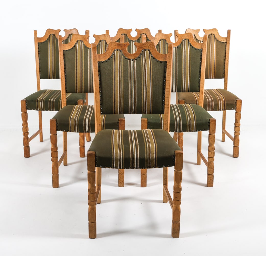 (6) HENNING KJAERNULF DANISH OAK DINING CHAIRS: Oak frames with green striped wool upholstery. Brass tacks accents. Dimensions: H 37.5" x W 17.5" x D 17.75" x SH 17.75". Condition: Minor scuffs and rubs to wood. Faint water spots. Wear consistent w