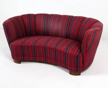 MID-CENTURY DANISH BANANA SOFA C. 1950S: Striped wool upholstery with channel back design. Beech legs. Dimensions: H 26.5" x W 63" x D 36" x SH 13.5". Condition: Some sun fading to fabric. Scuffs and scratches to legs. Wear consistent with a