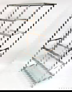 MILO BAUGHMAN STYLE CHROME & GLASS ETAGERE: Geometric shelving pattern with a chrome frame and (6) glass shelves. Apparently unmarked. Dimensions: H 76" x W 41" x D 17" Condition: Light surface marks. A small nick to the corner of two glass she