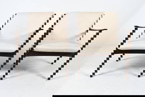OLE WANSCHER FOR POUL JEPPESEN MODEL PJ112 CHAIRS: Elevate your living space with this exquisite pair of PJ 112 lounge chairs, a timeless creation by the visionary Ole Wanscher for Poul Jeppesen. Crafted from rich mahogany, the frames of these chairs