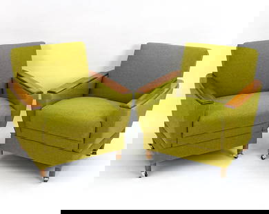 PAIR OF GERMAN WALNUT LOUNGE CHAIRS, C. 1960S: Green boucle fabric with walnut arms and legs, on chrome casters. Dimensions: H 31" x W 29" x D 29" x SH 18" Condition: Very light surface wear, fabric appears to be original. PM113