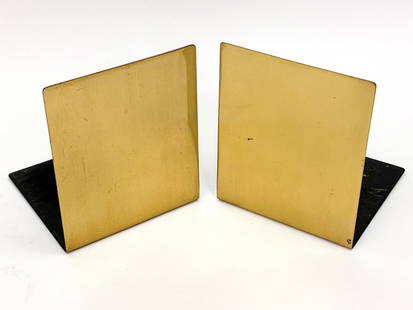 KNOLL SMOKADOR BRASS BOOKENDS: Manufactured by Smokador, retailed by Knoll. Circa 1970s. Marked on underside. Dimensions: H 6" x W 5" x D 5.25" Condition: Some loss of felt. Light handling wear.