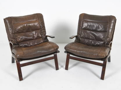 PAIR OF FARSTRUP BEECH & LEATHER EASY CHAIRS: Pair of 'Miljo' Farstrup lounge chairs. Beech bentwood frames with brown leather cushions. Denmark, circa 1960s. Dimensions: H 34.5" x W 26" x D 24" x SH 18". Condition: Some fading and rubbing to woo