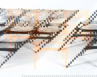 (8) ERIK BUCH STYLE DANISH TEAK DINING CHAIRS 1960: Teak frames with patterned fabric upholstery. Denmark, circa 1960s. Dimensions: H 32" x W 19" x D 16" x SH 18.25". Condition: Minor scuffs and scratches to frames. Wear consistent with age and use. PE