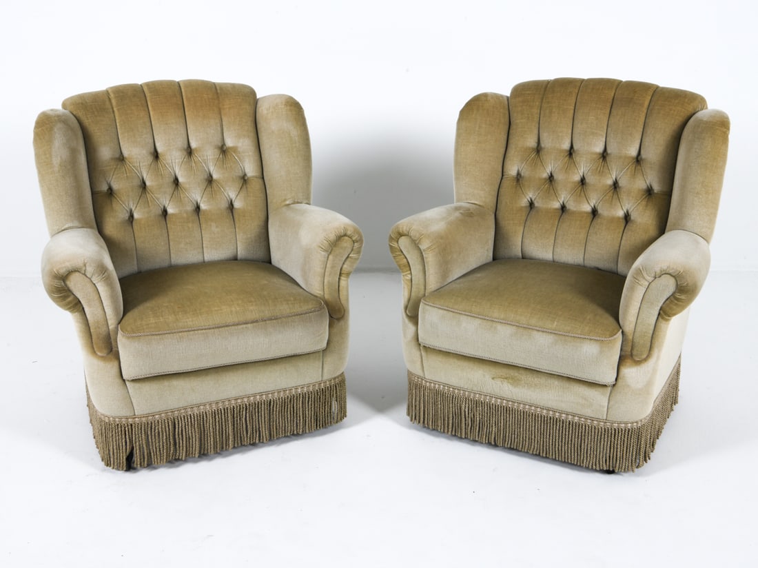 MID-CENTURY DANISH MOHAIR LOUNGE CHAIRS: Green-tone mohair upholstery with tufted backrests. With fringe skirt. Dimensions: H 35" x W 32.5" x D 26", HS 17" Condition: Minor scattered blemishes to upholstery. Rubbing and thinning to backrests