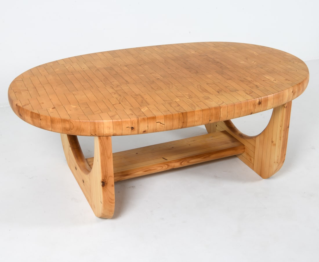 MID-CENTURY SCANDINAVIAN PINE COFFEE TABLE: With sculptural rounded legs. Dimensions: H 20" x W 56" x D 35.5" Condition: Light nicks and dings to surface and legs. Presents well overall. PER E055