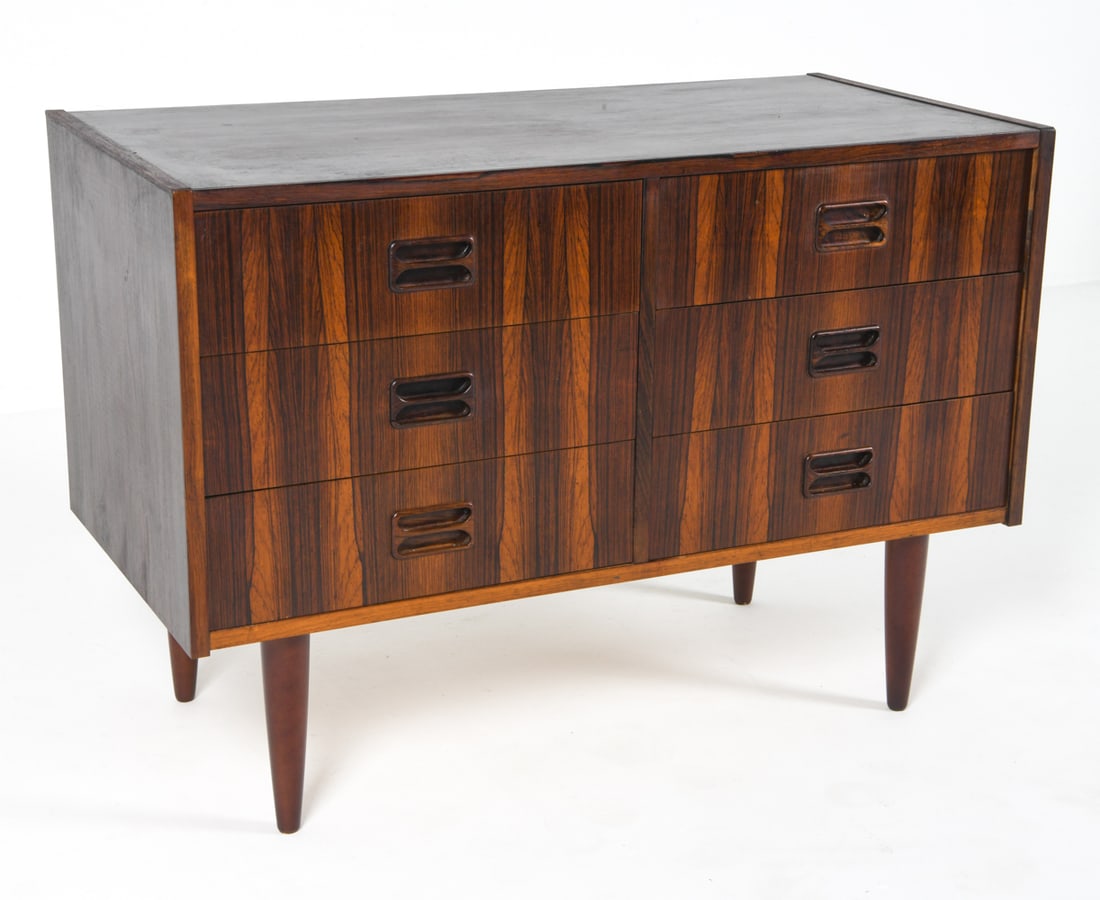 DANISH ROSEWOOD LOW CHEST C. 1960S: Dimensions: H 24" x W 34.5" x D 16.75". Condition: Minor scratches and dings, some rubbing to top. Wear consistent with age and use. Slight musty odor within. PER F055