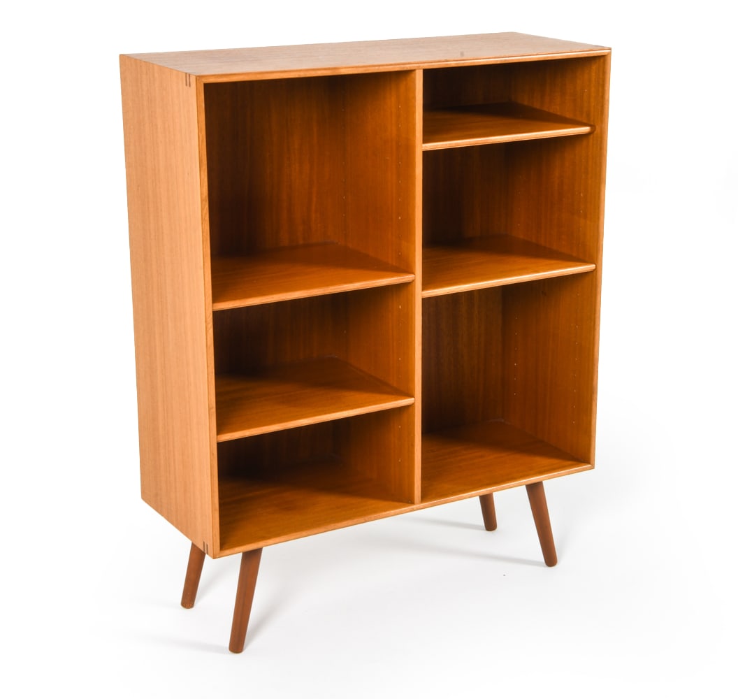 DANISH TEAK BOOKCASE C. 1960S: Adjustable shelves. Dimensions: H 40.25" x W 31.5" x D 12.5". Condition: Minor rubbing and surface scratches. Moderate watermark to top. Wear consistent with age and use. PER F060