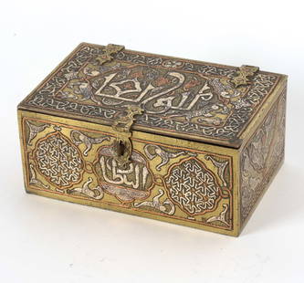 19TH C. DAMASCUS BRASS, SILVER & COPPER BOX: Etched with exterior designs and writing. Lined with copper and silver. Dimensions: H 2.5" x W 6" x D 4" Condition: Patina and tarnishing to brass throughout. Wear consistent with age and use.