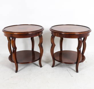 PAIR BAKER MILLING ROAD MAHOGANY SIDE TABLES: Labels to undersides. Dimensions: H 27.25" x Dia 28.5" Condition: Slight scuffs, and light blemish marks to lower tiered shelf. Wear consistent with age and use,