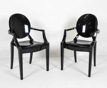 PAIR KARTELL 'LOUIS GHOST' ARMCHAIRS: Marked to backside. Glossy black plastic. Balloon backs. Dimensions: H 36.75" x W 20.75" x D 17", SH 18.5" Condition: moderate scuffs to scratches. Wear consistent with age and use.