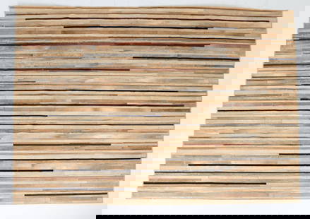 LARGE KYLE BUNTING HIDE RUG: Large area rug made from varying types and colors of animal fur hide. Tagged under corner. Dimensions: L 144" x W 108". Condition: Slight balding in places. Wear consistent with age and use.