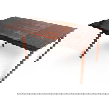 DUTCH ROSEWOOD DROP LEAF DINING TABLE C. 1960S: Rosewood drop leaf table. Top slides to accommodate leaf. Dimensions: H 28.5" x W (w/ leaf) 75" x D 33.5". Condition: Thin surface scratches, few water spots. Wear consistent with age and use. PN142