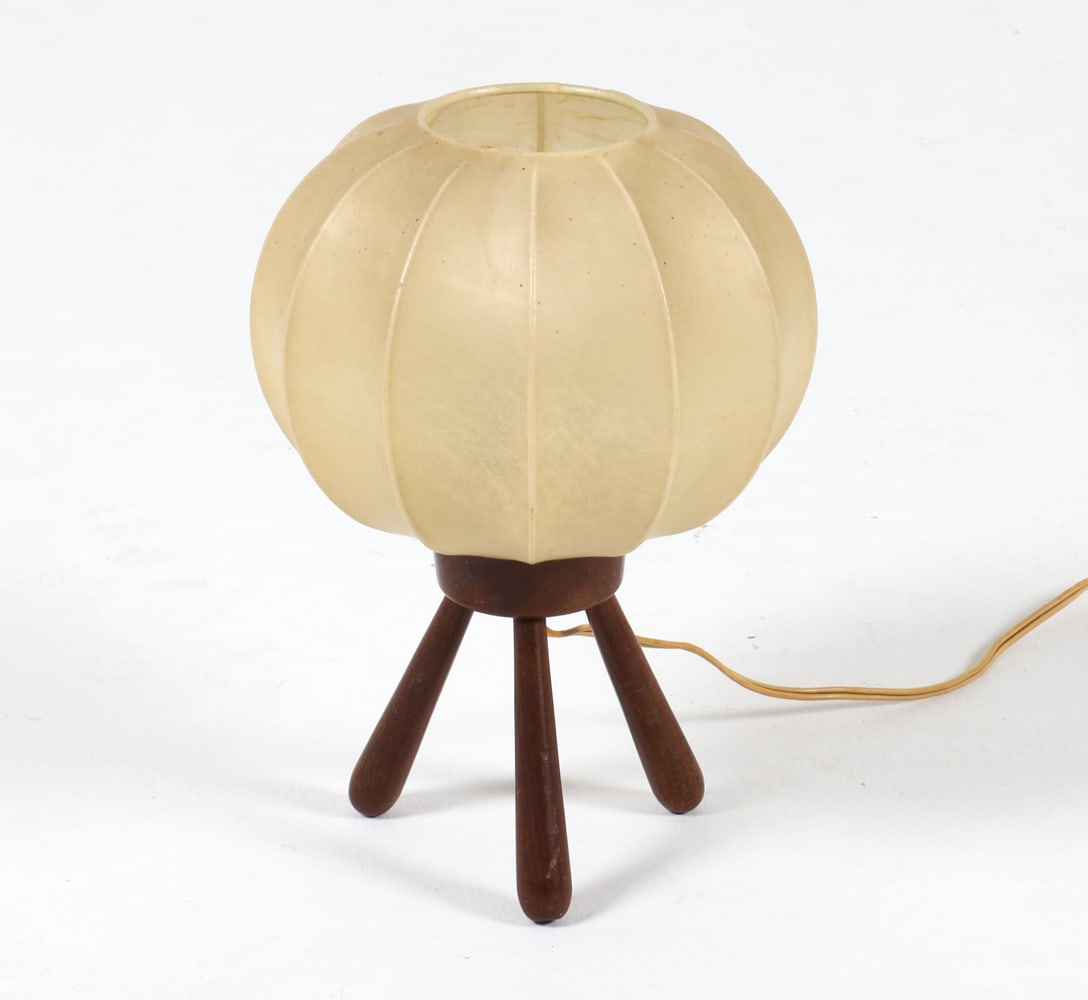 DANISH OAK COCOON SHADE TABLE LAMP C. 1950S: Dimensions: H 12" x Dia. 7.75". Condition: Wiring untested, European plug. Minor scuffs to wood. Wear consistent with age and use. PN060