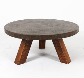 DUTCH BRUTALIST OAK & COPPER COFFEE TABLE C. 1970S: Oak coffee table with copper or bronze top. Top has texture and depictions of horse drawn chariots to rim. Dimensions: H 17.5" x Dia. 38.5". Condition: Few dings and dents to metal top. Wear consisten