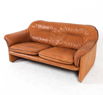 DE SEDE DS 16 LEATHER SOFA C. 1970S: Brown leather 2-seat sofa. Switzerland, circa 1970s. Dimensions: H 29" x W 56" x D 33" x SH 16". Condition: Minor scuffs and scratches to leather. Wear consistent with age and use. PN171